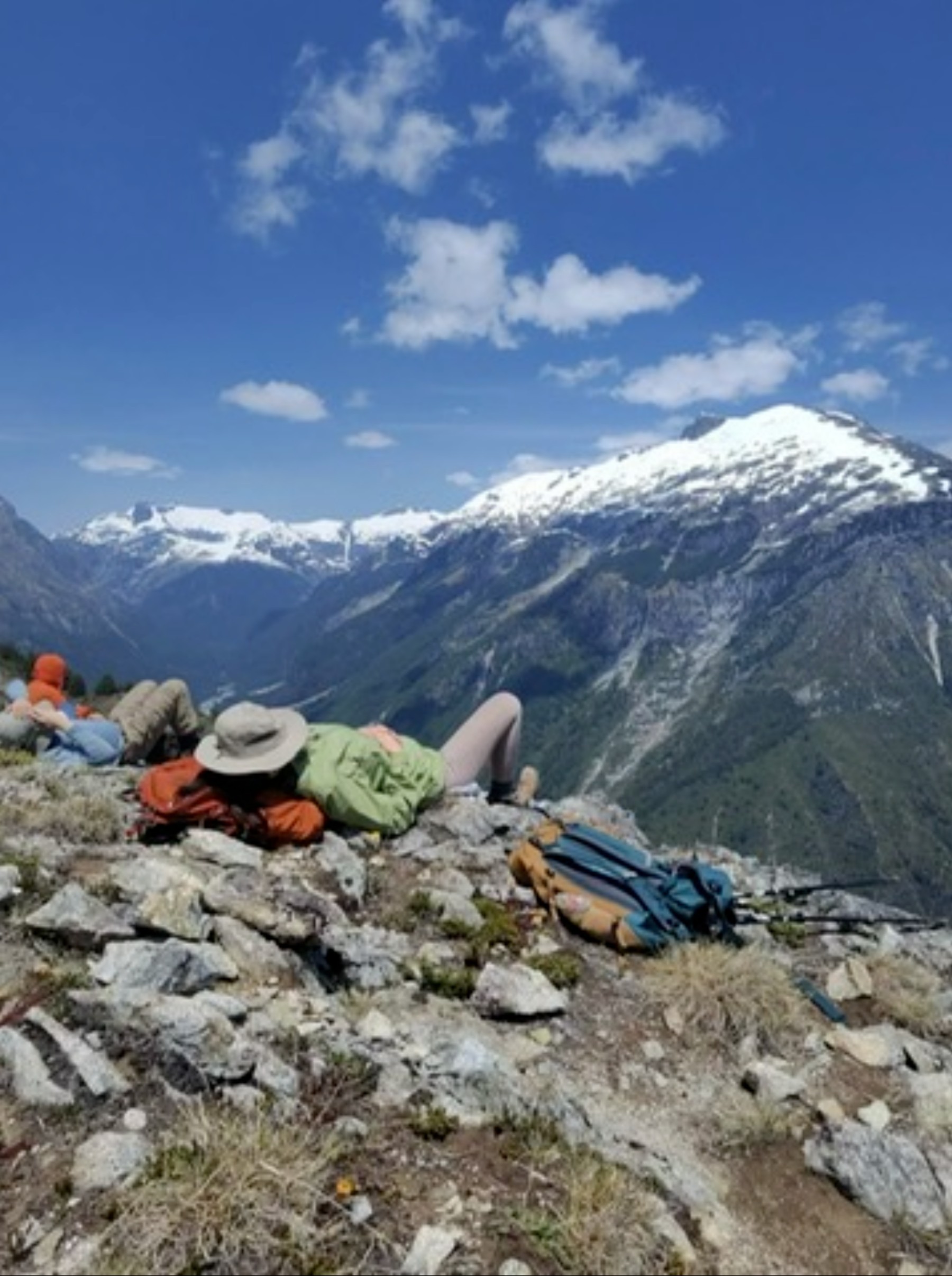 Resting on a rocky overlook above a mountain valley