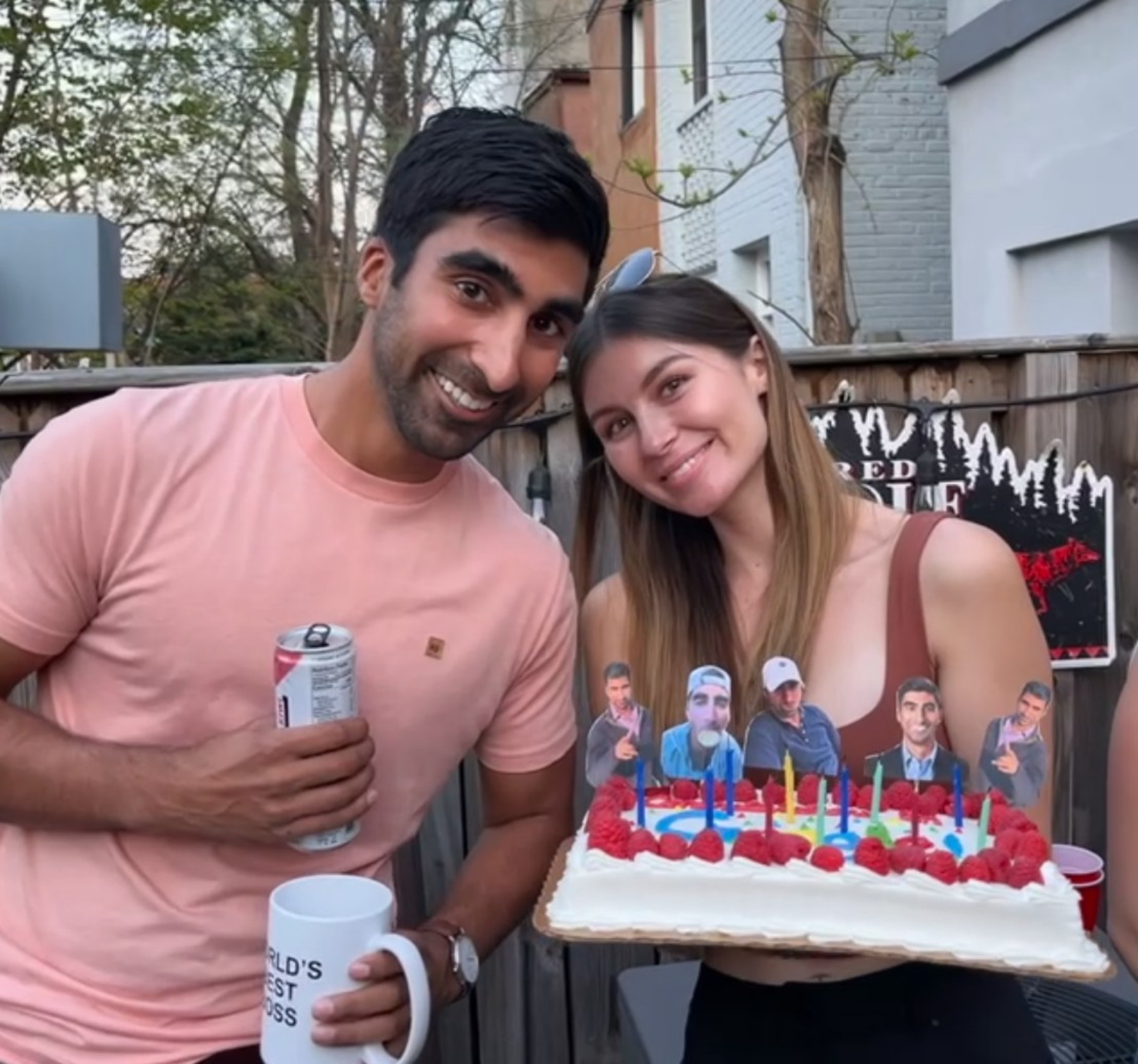 Cate and Brij celebrating with a birthday cake