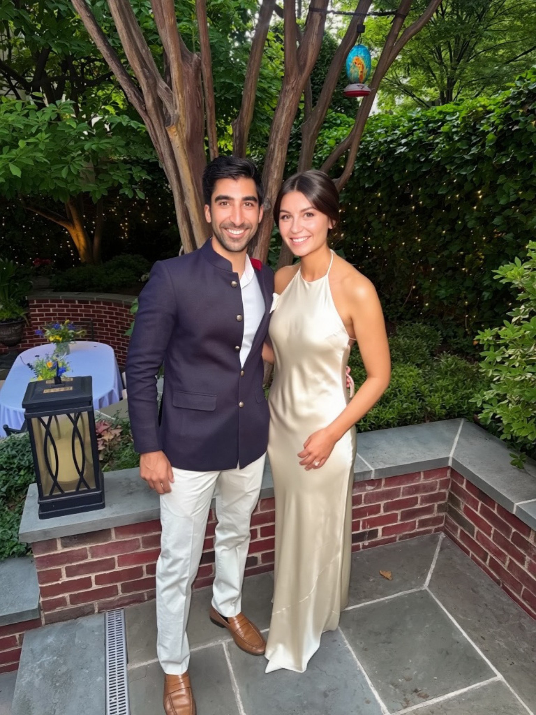 Cate and Brij together in the garden at their DC engagement party