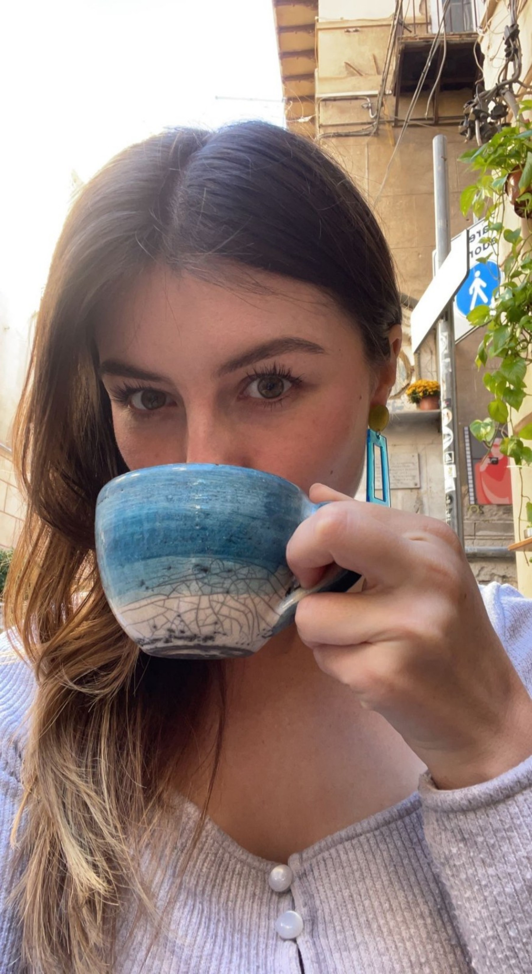 Cate enjoying a coffee during her time in Sicily