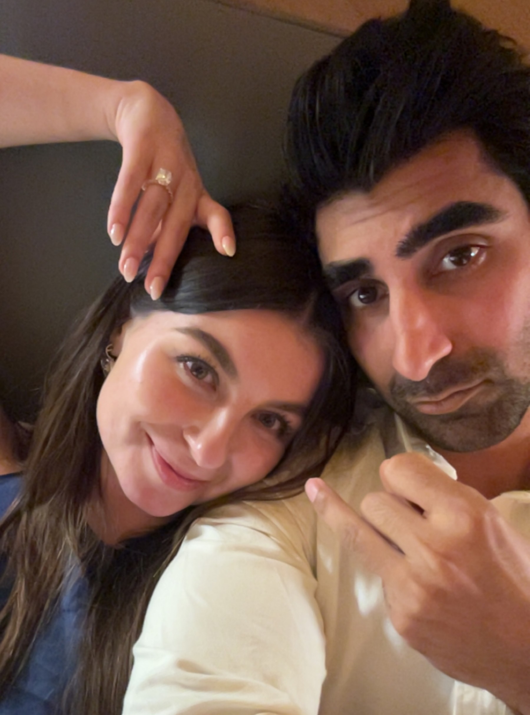 Cate and Brij taking a close-up selfie after their engagement