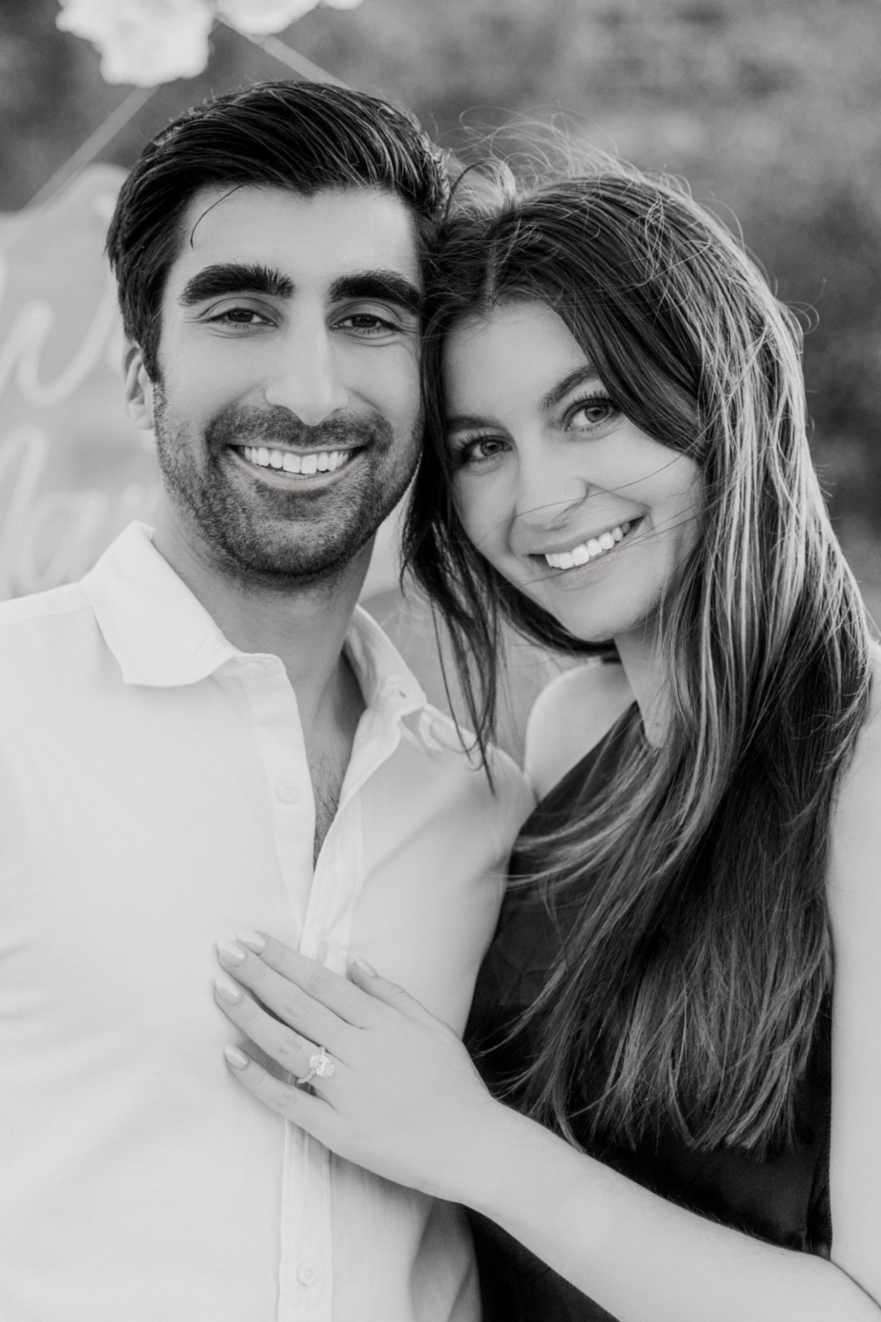 Black-and-white engagement portrait of Cate and Brij