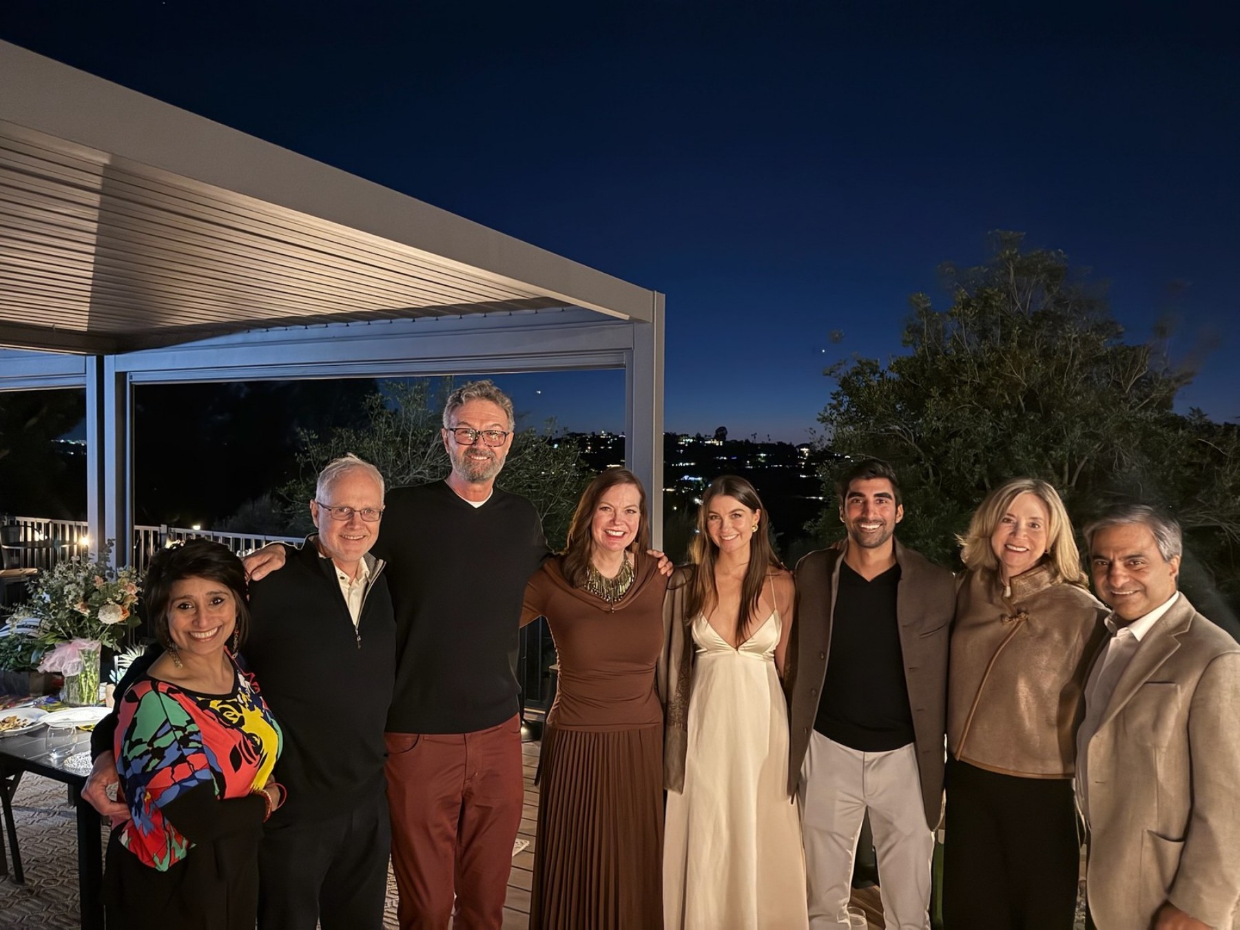 Cate and Brij celebrating with family at the surprise engagement party at her parents’ home in San Diego